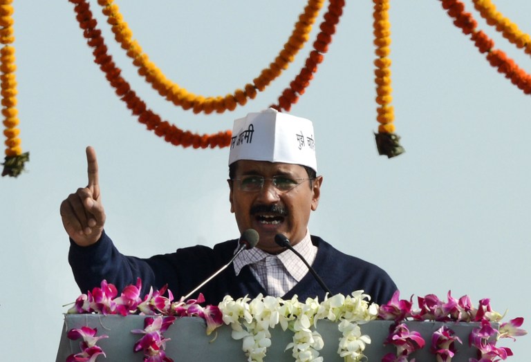 Chief Minister of India's national capital region Arvind Kejriwal  addresses supporters after taking his oath of office in New Delhi, Decr 28. 2013. His anti-corruption hotline has been overwhelmed with calls, reports said. u00e2u20acu201d AFP pic