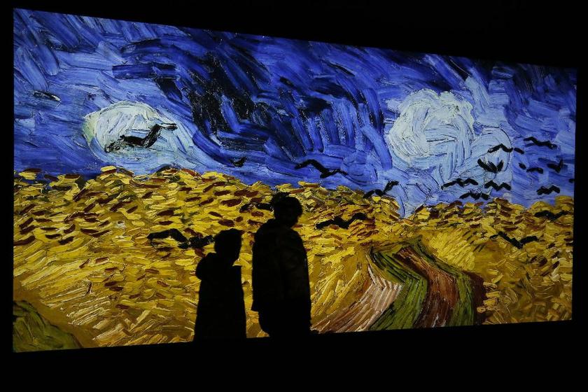 A projection of the painting 'Champ de Ble aux Corbeaux', Auvers sur Oise in July 1890, by Vincent van Gogh during press day, 'Van Gogh/Artaud The Man Suicided by Society' exhibition, Musee d'Orsay, Paris, March 10, 2014 Reuters