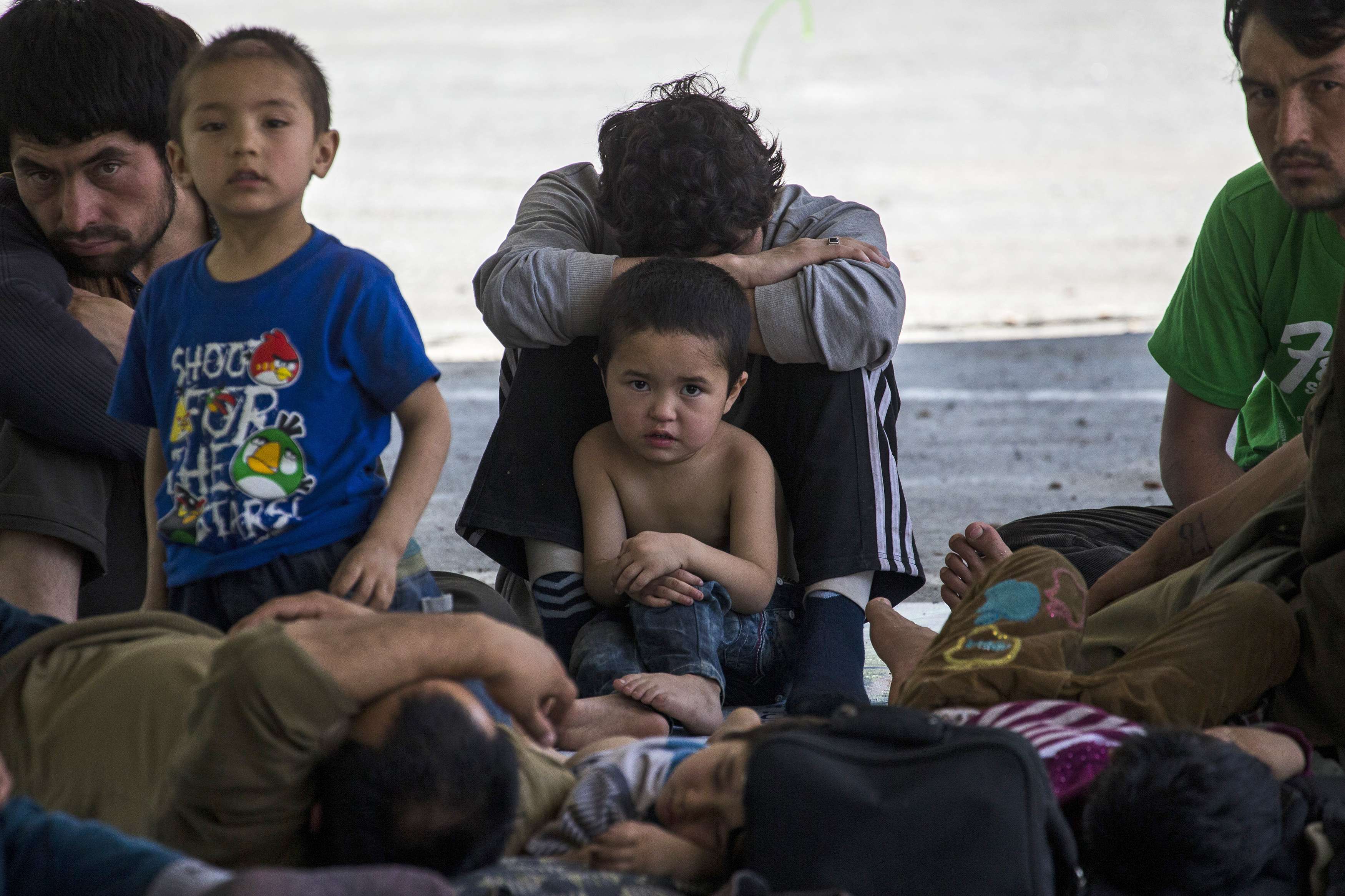 Suspected Uighurs from China's troubled far-western region of Xinjiang, rest inside a temporary shelter after they were detained at the immigration regional headquarters near the Thailand-Malaysia border in Hat Yai, Songkla March 14, 2014. u00e2u20acu201d Reuters pic