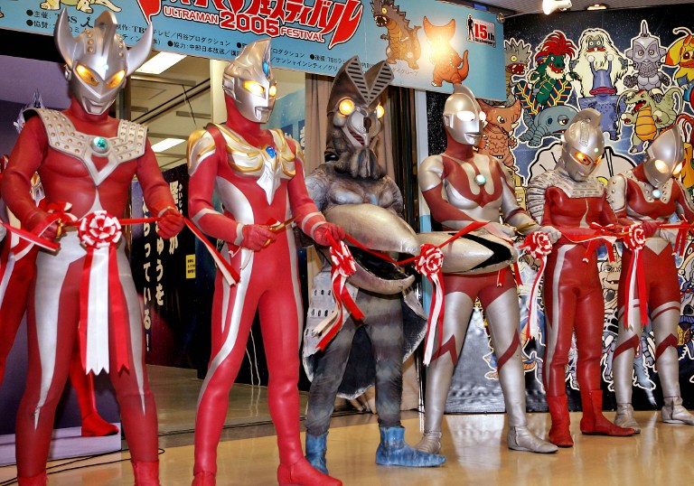 Ultraman family and Alien Baltan (centre) cut the ribbon during the opening of the Ultraman Festival 2005 in Tokyo, 22 July 2005. u00e2u20acu201d AFP pic