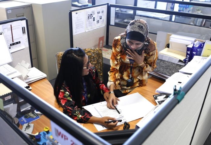 Malaysian government employees work inside the Land Puclic Transport Commission (SPAD) office in Putrajaya October 9, 2013 Reuters