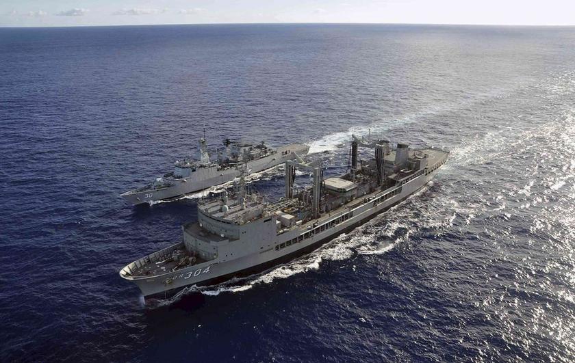 The Australian Navy ship HMAS Success (front) performs a Replenishment at Sea evolution with the Royal Malaysian Navy ship KD Lekiu, providing it with more fuel during the continuing search for the missing Malaysian Airlines flight MH370, in the southern 
