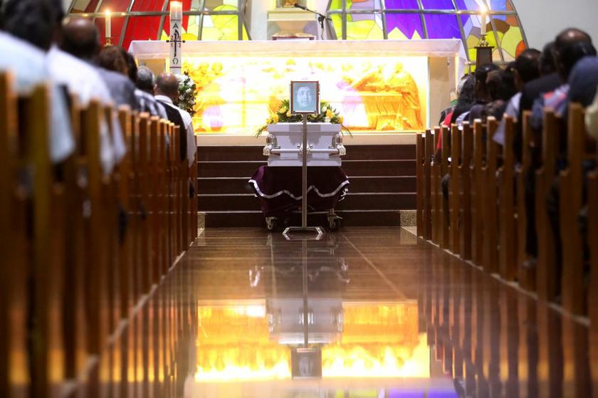 The casket of Irene Fernandez can be seen during the funeral service at the Divine Mercy Church, in Shah Alam, on April 3, 2014.
