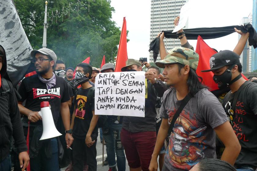 Protesting youths that were involved in an altercation with PAS volunteers during the May Day rally at Merdeka Square in Kuala Lumpur, May 1, 2014. u00e2u20acu201d Picture by Pathma Subramaniam