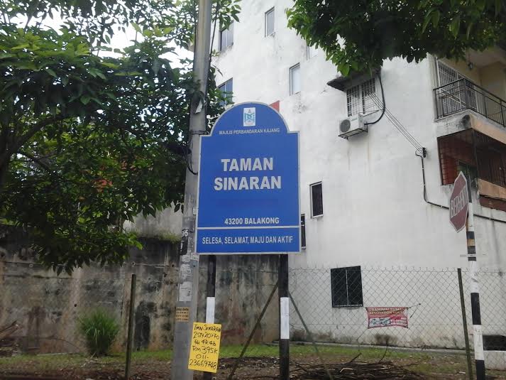 A signboard for Taman Sinaran, the neighbourhood where a dog was shot with two arrows yesterday, is shown in this photo, taken May 15, 2014. u00e2u20acu201d Photo by Yap Tzu Gingn