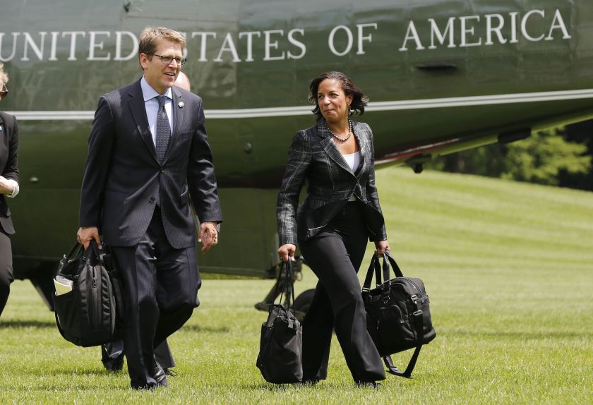 National Security Adviser Susan Rice (right) and Press Secretary Jay Carney walk away from Marine One on the South Lawn at the White House in Washington, May 28, 2014. — Reuters pic