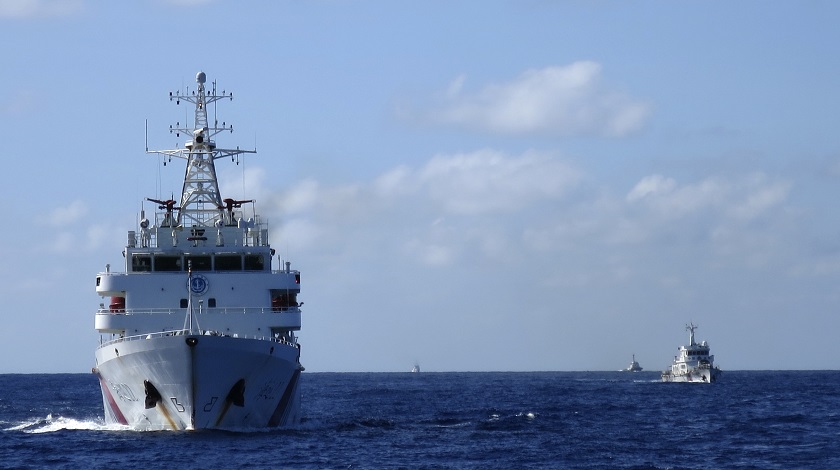 Chinese coastguard ships give chase to Vietnamese coastguard vessels (not pictured) after they came within 10 nautical miles of the Haiyang Shiyou 981, known in Vietnam as HD-981, oil rig in the South China Sea, July 15, 2014. u00e2u20acu201d Reuters pic