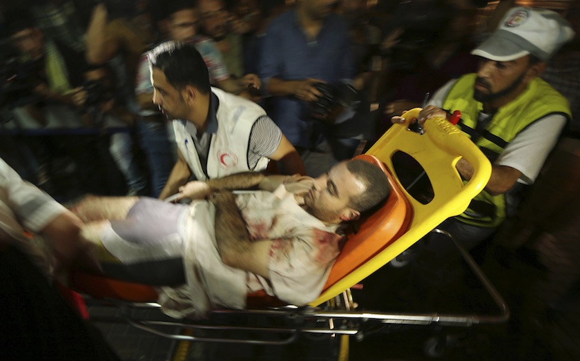 A wounded Palestinian, who hospital officials said was injured in an Israeli air strike, is wheeled into a hospital in Gaza City July 12, 2014. u00e2u20acu201d Reuters pic