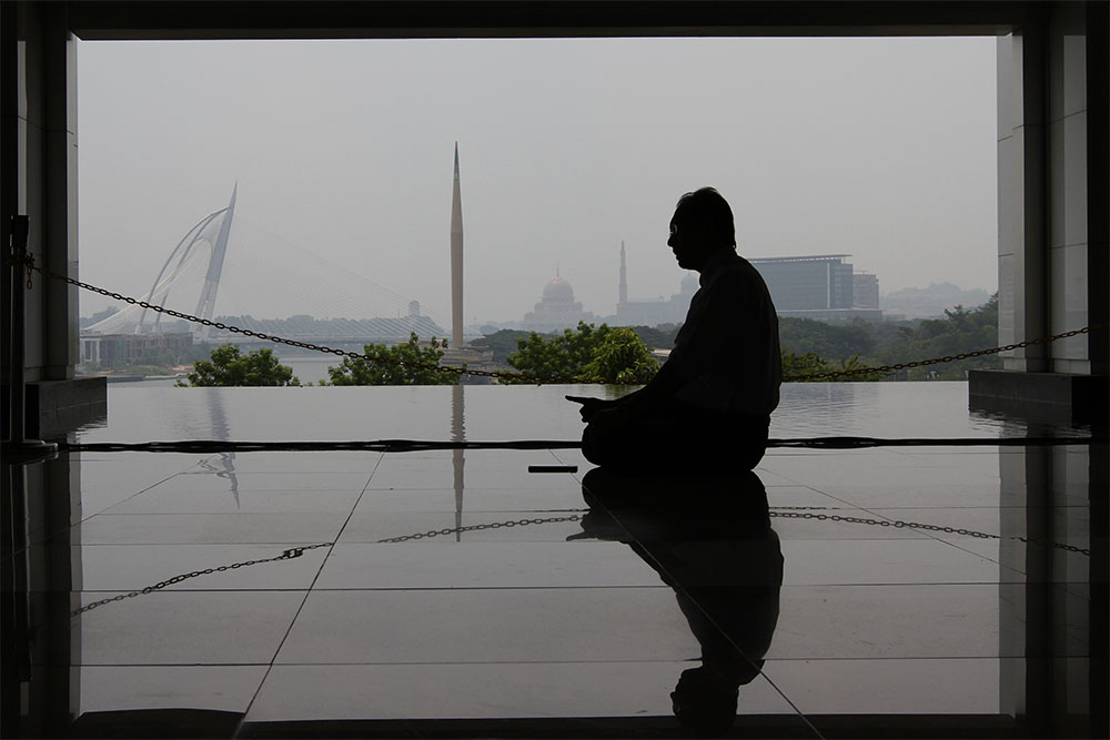 A Muslim performs his prayers at the Tuanku Mizan Mosque in Putrajaya amid hazy conditions, July 7, 2014.u00e2u20acu201d Picture by Yusof Mat Isa