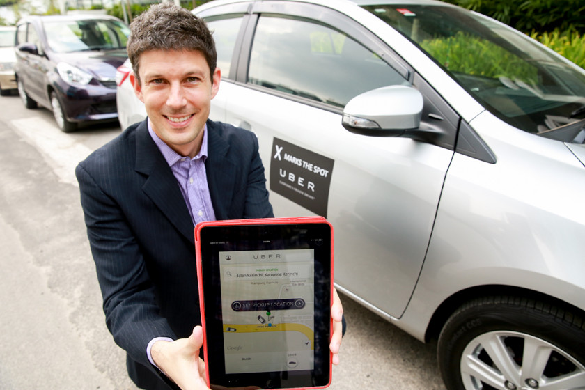 Regional General Manager of Uber Technologies in Southeast Asia Michael Brown poses in front of the newly launched UberX range, on August 6, 2014. u00e2u20acu201d Picture by Saw Siow Feng