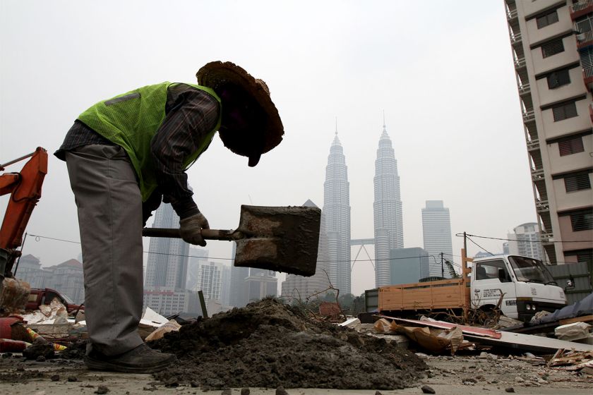 A foreign workers get on with his daily task at a residential area that was demolished for development on a hazy day in Kuala Lumpur, October 7, 2014. u00e2u20acu201d Picture by Yusof Mat Isa  