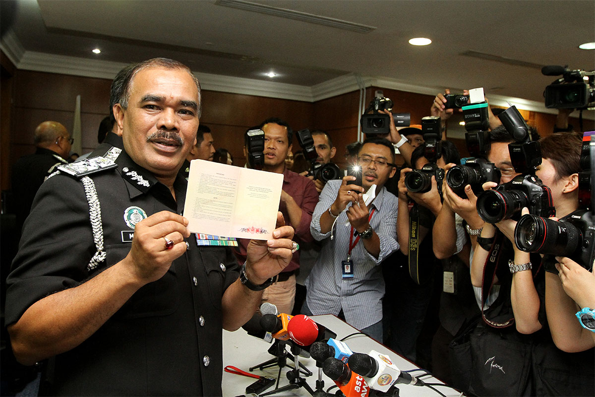 Director General of Immigration Malaysia, Datuk Mustfa Ibrahim show the Malaysian Passport to the media during press conference at the Jabatanu00c2u00a0Immigrationu00c2u00a0Malaysia in Putrajaya, December 8, 2014. u00e2u20acu201d Picture by Yusof Mat Isa 