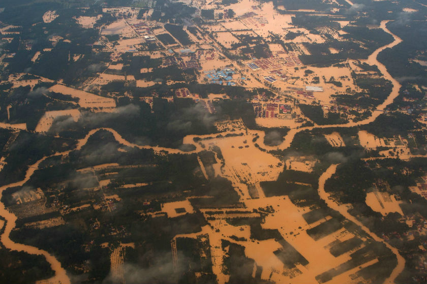 This aerial view shows houses and plantations submerged in floodwaters in Pengkalan Chepa, near Kota Baru, Kelantan on December 28, 2014. u00e2u20acu201d AFP pic