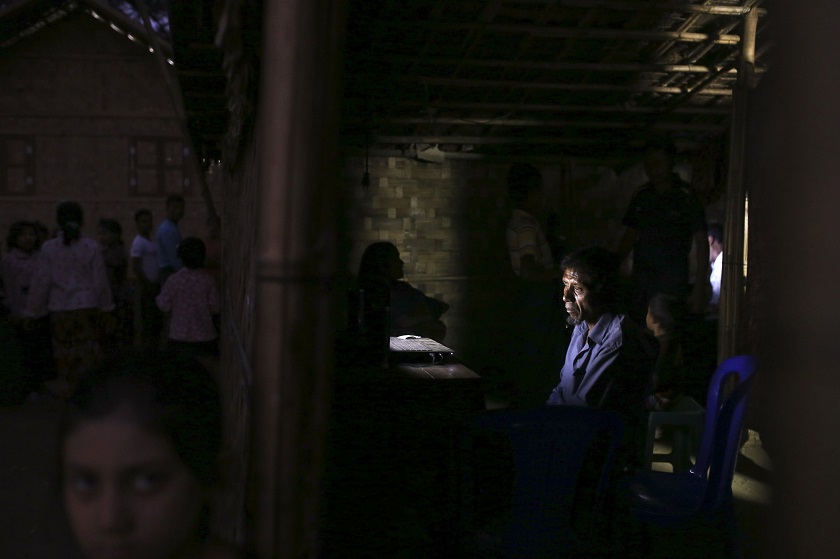 People gather in and around an internet hut in Thae Chaung village, home to thousands of displaced Rohingya Muslims near Sittwe, the capital of Rakhine State in western Myanmar, February 15, 2015. — Reuters pic