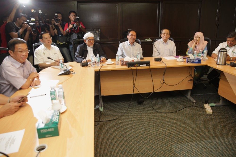 PKR leaders led by Datuk Sri Anwar Ibrahim (centre) talk to the press at the Pakatan Rakyat Council meeting at the PAS headquarters in Kuala Lumpur, February 8, 2015. — Picture by Choo Choy May