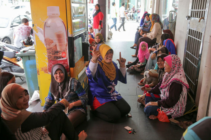 Women spotted on April 30, 2015, camping outside the Fareeda Bangi store to buy the new designs of tudung that will be launched on May 1, 2015. u00e2u20acu201d Picture by Choo Choy May 
