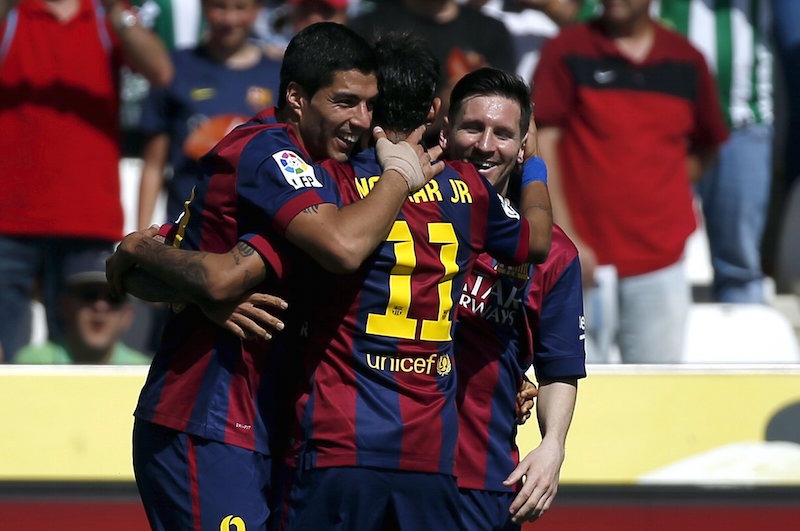 Barcelona's Luis Suarez celebrates a goal with team mates Lionel Messi and Neymar during their Spanish first division match against Cordoba in Cordoba May 2, 2015. u00e2u20acu201d Reuters pic