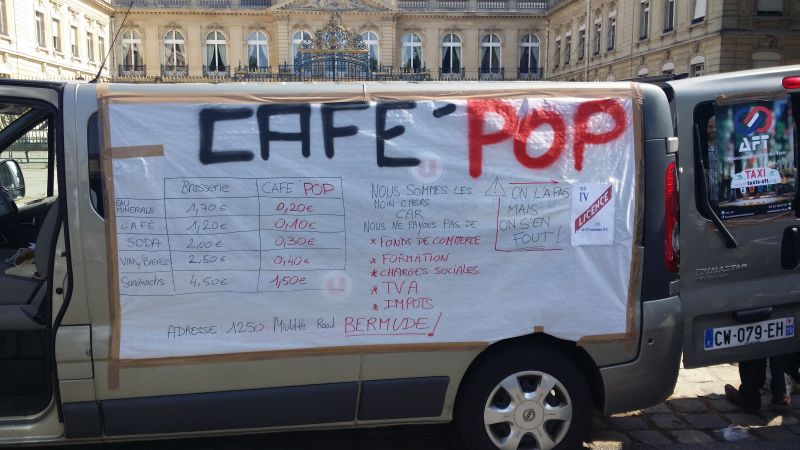 Call-based taxi owner Olivier attended the more peaceful protests at the Prefecture of Versailles. UberPOP = no taxi licence = cheap ride. Next? CafePOP = no alcohol licence = cheap drink. ― File pic