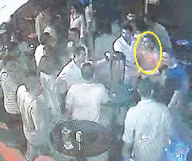 CCTV footage of the shooting at Madurai club on August 26, 2012.  One of the suspects (circled) is still at large. u00e2u20acu2022 Malay Mail pic