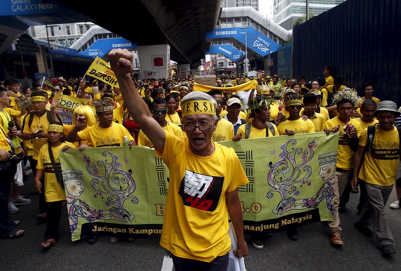 A Bersih supporter leads a group of Orang Asli, as they march to Dataran Merdeka in Kuala Lumpur August 30, 2015.  u00e2u20acu201d Reuters pic
