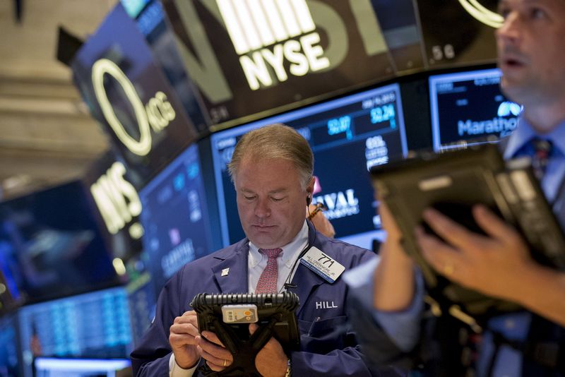 Traders work on the floor of the New York Stock Exchange (NYSE) July 14, 2015. u00e2u20acu201d Reuters pic 