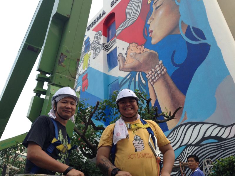 Local artists Harold Egn Eswar (right) and Kwan Thung Seng are among those commissioned to bring some patriotic spirit to the city's walls with a street art project #tanahairku. u00e2u20acu2022 Picture by Julia Chan