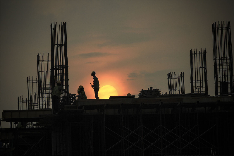 Construction workers are silhouetted against the evening sky in Kuala Lumpur, September 10, 2015. u00e2u20acu201d Picture by Yusof Mat Isa