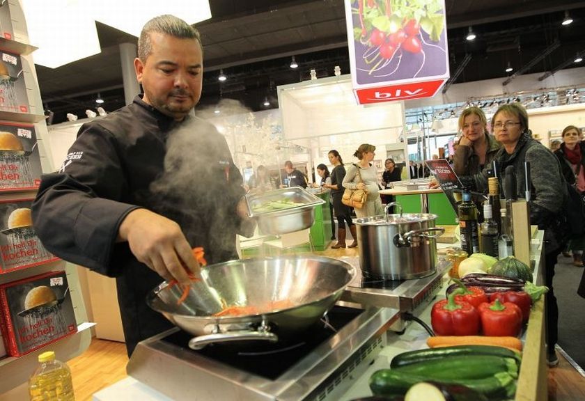 Professional cook Murat Salzer prepares vegetables during a show at the cookbooks publisher Bly booth in the so-called Gourmet Gallery at the Book Fair in Frankfurt am Main, western Germany on October 14, 2015. u00e2u20acu201d Afp-Relaxnews pic