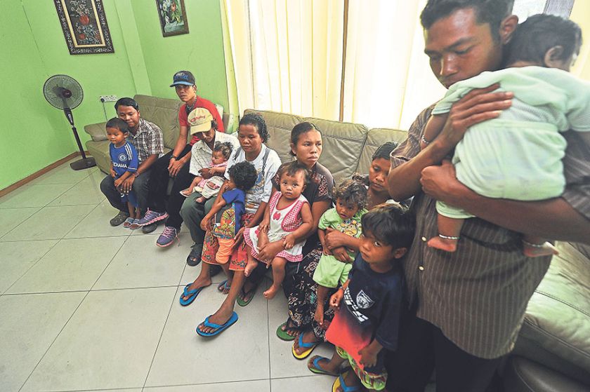 Families of four of the children wait for news at the Goa Hotel in Gua Musang. u00e2u20acu201d Picture by Azinuddin Ghazali