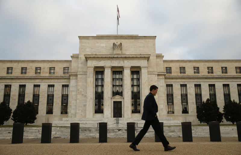 A man walks past the Federal Reserve in Washington, December 16, 2015. u00e2u20acu201d Reuters pic