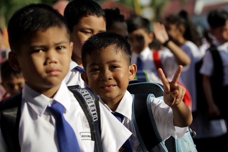 Schoolchildren are seen here on the first day of school, a place where illegitimate Muslim children may face questions from friends about their names. ― Picture by Yusof Mat Isa