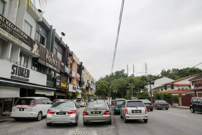 With a commercial area just across their narrow street, residents argue that allowing more commercial activities in the area would only exacerbate the existing traffic congestion they face in the residential area.  