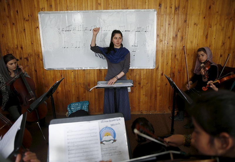 Negin Ekhpulwak, leader of the Zohra orchestra, an ensemble of 35 women, conducts during a rehearsal at Afghanistanu00e2u20acu2122s National Institute of Music, in Kabul, Afghanistan April 9, 2016. u00e2u20acu201d Reuters pic