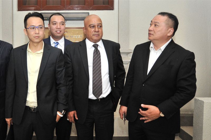 (From left) Chin, defence counsel Datuk Nicholas Kow, Haaziq and Joseph Kow leave the courtroom yesterday. u00e2u20acu201d Picture by Azinuddin Ghazali