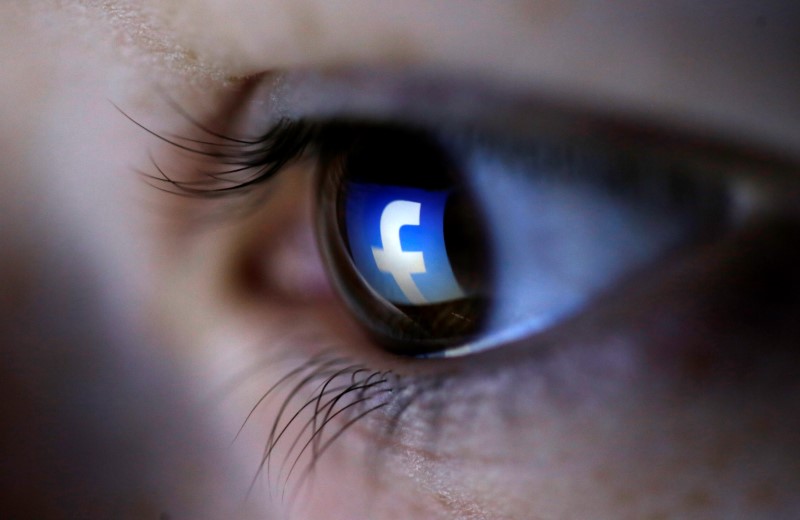 A picture illustration shows a Facebook logo reflected in a personu00e2u20acu2122s eye, in Zenica, March 13, 2015.  u00e2u20acu201d Reuters pic