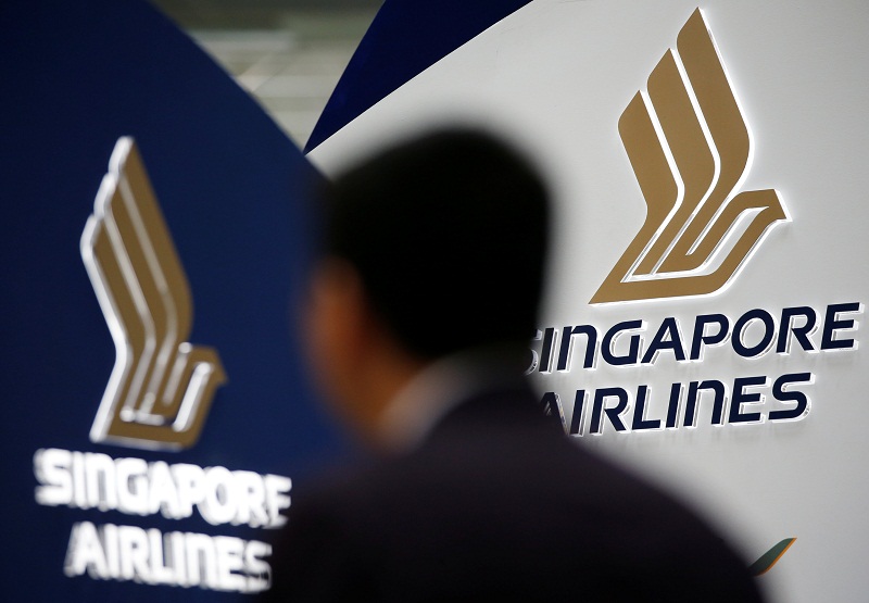 A man walks past a Singapore Airlines signage at Changi Airport in Singapore May 11, 2016. u00e2u20acu201d Reuters pic