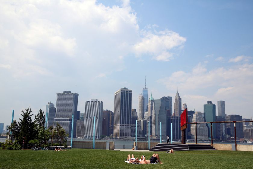 The skyline of lower Manhattan is seen as people lay on the grass in Brooklyn Bridge Park in the Brooklyn borough of New York City, US, May 28, 2016. u00e2u20acu201d Reuters pic