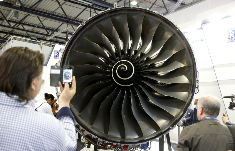 Visitors look at a Rolls-Royce Trent XWB aircraft engine at the companyu00e2u20acu2122s booth during the ILA Berlin Air Show in Schoenefeld, south of Berlin, Germany, June 1, 2016. u00e2u20acu201d Reuters pic