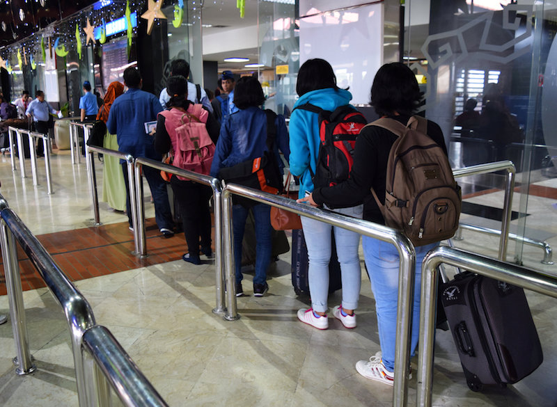A group of domestic helpers leaving for Hong Kong pass through the security check at Jakartau00e2u20acu2122s Soekarno-Hatta airport in Indonesia June 21, 2016. u00e2u20acu201d Reuters pic