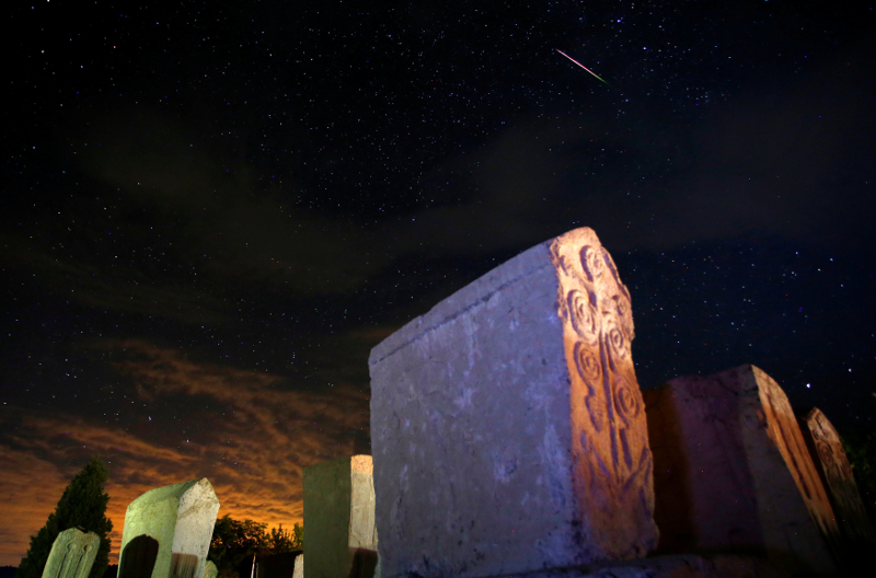 A meteor streaks past stars in the night sky above medieval tombstones in Radmilje near Stolac, south of Sarajevo, Bosnia and Herzegovina, August 12, 2016. u00e2u20acu201d Reuters pic