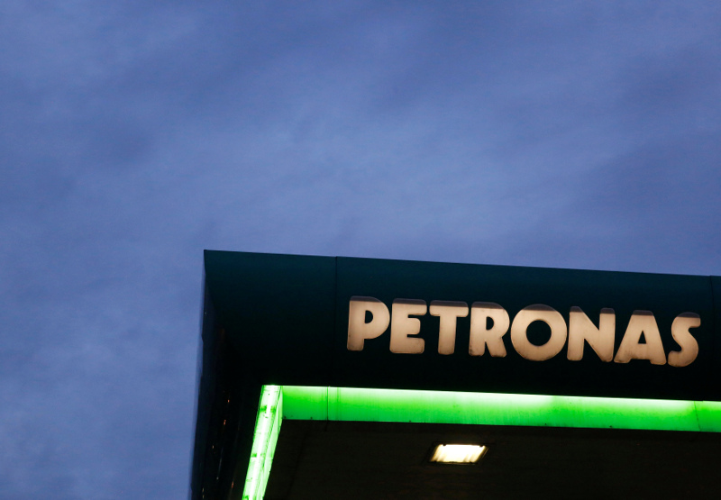 A logo of a Petronas fuel station is seen against a darkening sky in Kuala Lumpur, Malaysia February 10, 2016. — Reuters pic