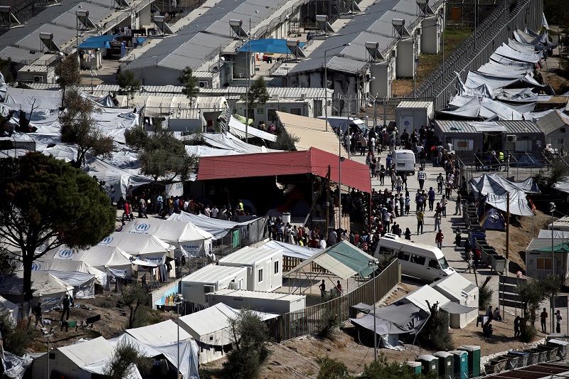 Refugees and migrants line up for food distribution at the Moria migrant camp on the island of Lesbos, Greece October 6, 2016. u00e2u20acu201d Reuters pic