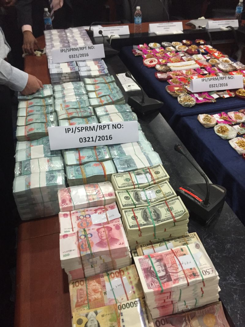 The cash was seized from the offices and houses of the two men in Kota Kinabalu in a day-long raid yesterday.
