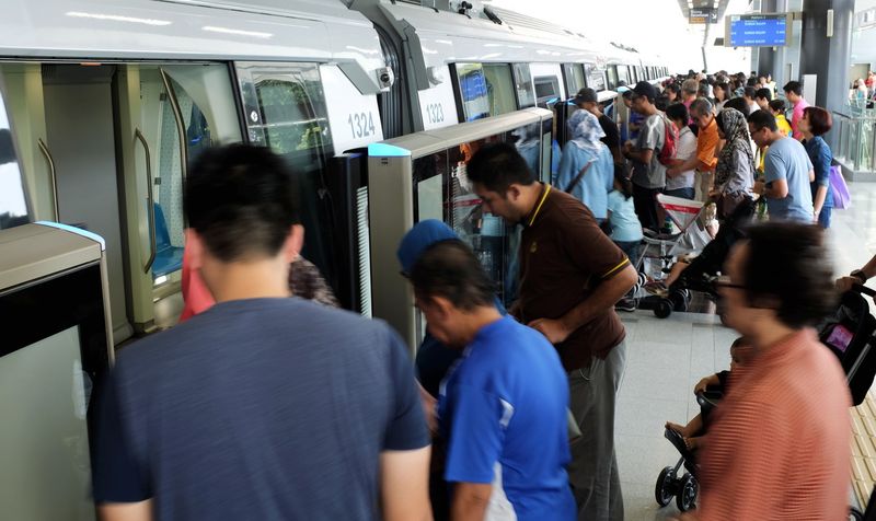 People taking advantage of the Christmas holiday to catch a free ride on the Mass Rapid Transit (MRT) Phase One line from the Sungai Buloh station to Damansara, December 25, 2016. u00e2u20acu201d Bernama pic