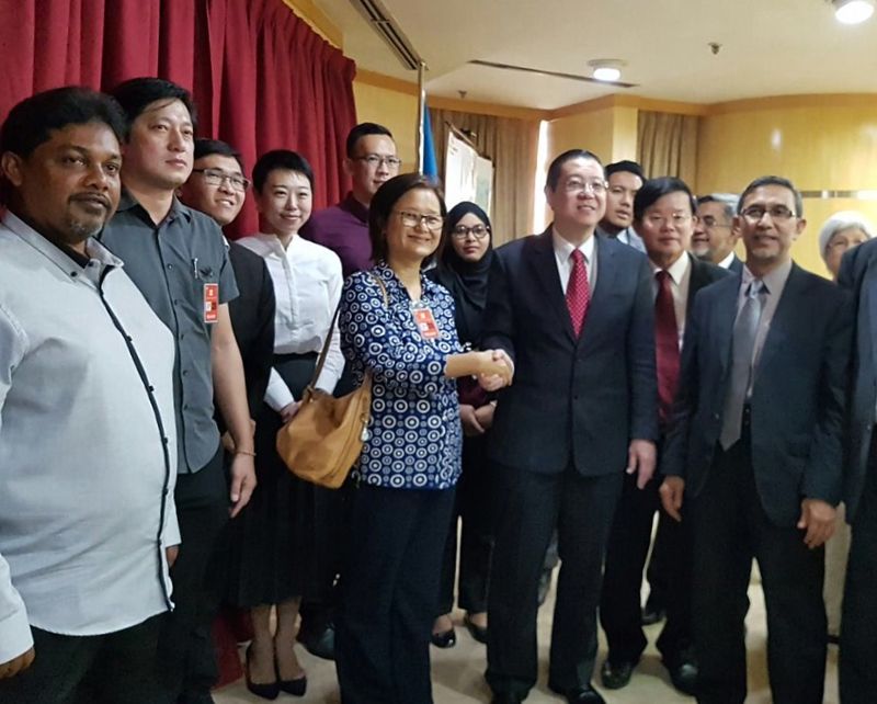 Penang Chief Minister Lim Guan Eng congratulating the newly appointed councillors at his office.