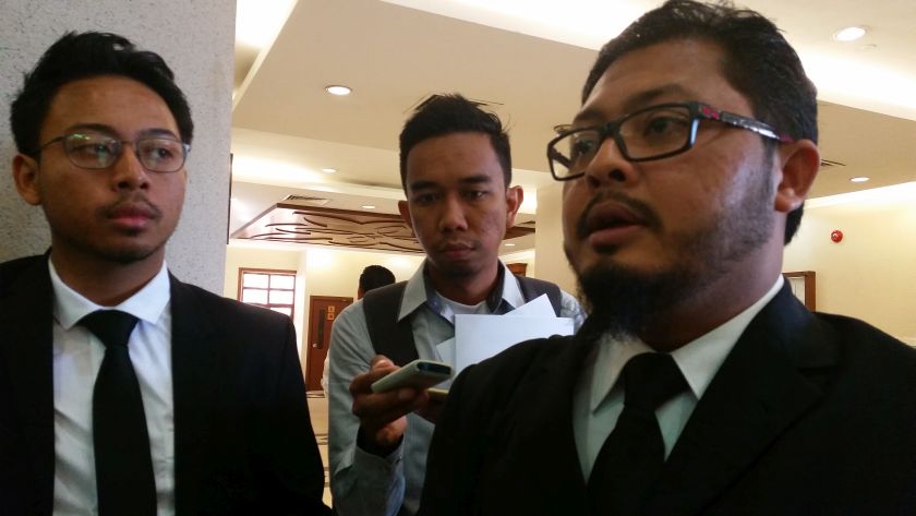 Lawyer Yusfarizal Yussoff (right) explains why his clients are suing JAWI over a wrongful khalwat raid and arrest as well as privacy breach. u00e2u20acu2022 Picture by Ida Lim