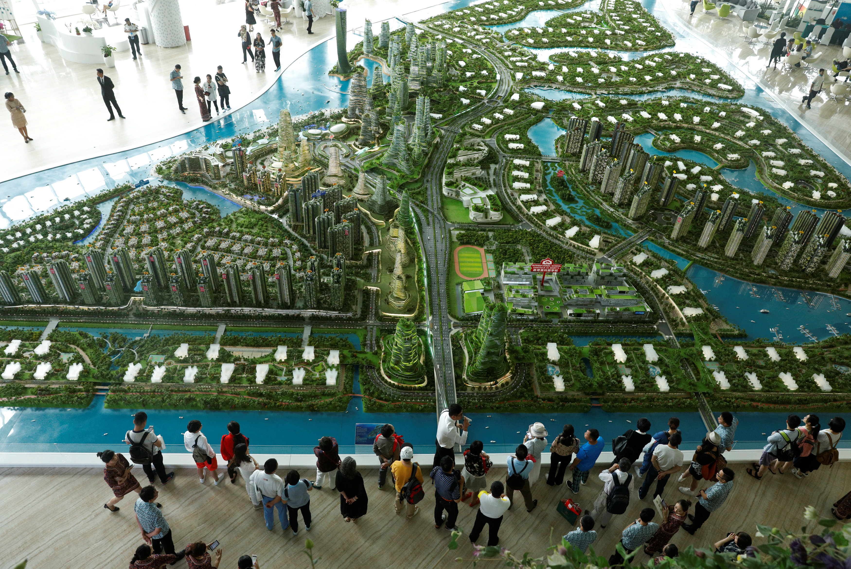 Prospects look at a model of the development at the Country Gardens' Forest City showroom in Johor Baru February 21, 2017. u00e2u20acu201d Reuters pic