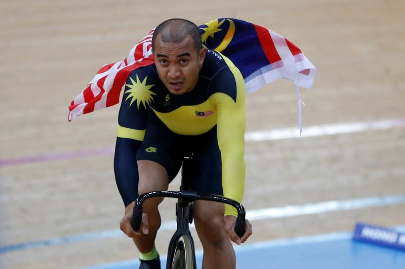 Malaysiau00e2u20acu2122s Mohd Azizulhasni Awang celebrates after winning gold in the Menu00e2u20acu2122s Keirin at the UCI Track World Championships in Hong Kong, April 13, 2017. u00e2u20acu201d Reuters pic