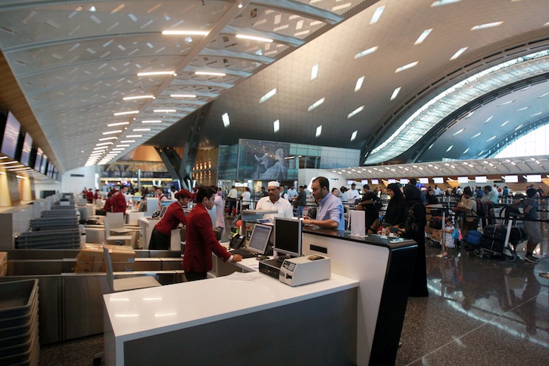 Staff members speak with passengers at Hamad International Airport in Doha, Qatar June 12, 2017. u00e2u20acu201d Reuters pic