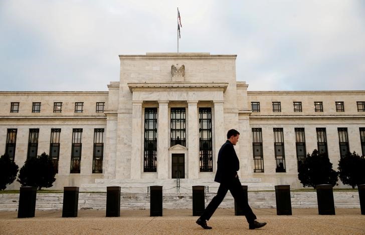 A man walks past the Federal Reserve Bank in Washington,  December 16, 2015.u00c2u00a0u00e2u20acu201d Reuters pic